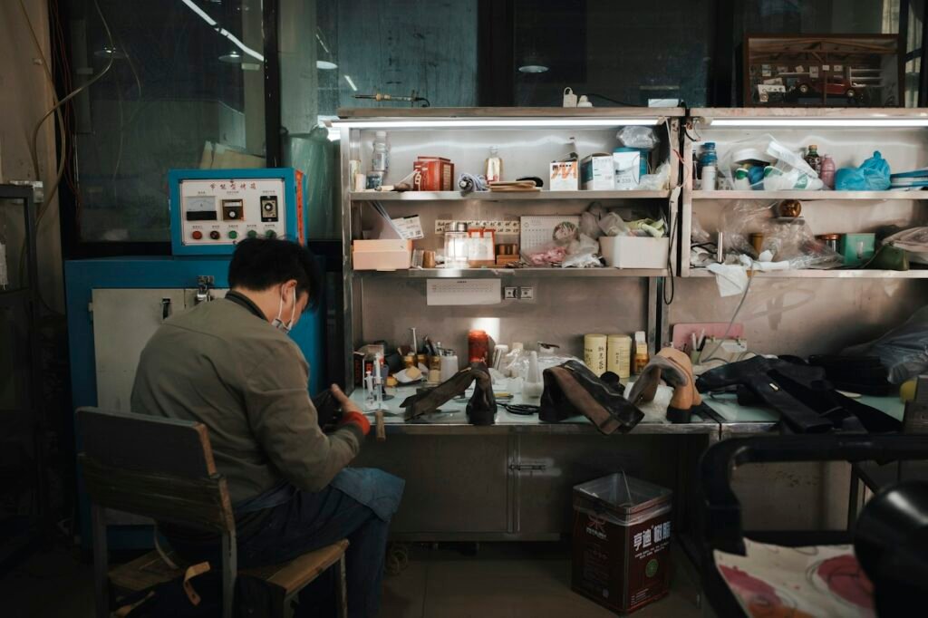 Craftsman at a shoemaking workbench